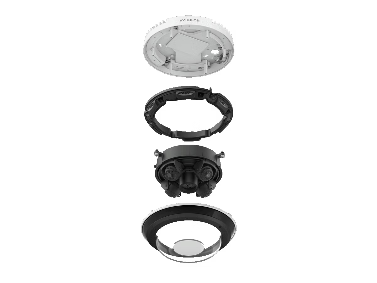 Caméra de surveillance démontée, quatre composants empilés.