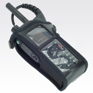 Radio device in black protective case, keypad visible.