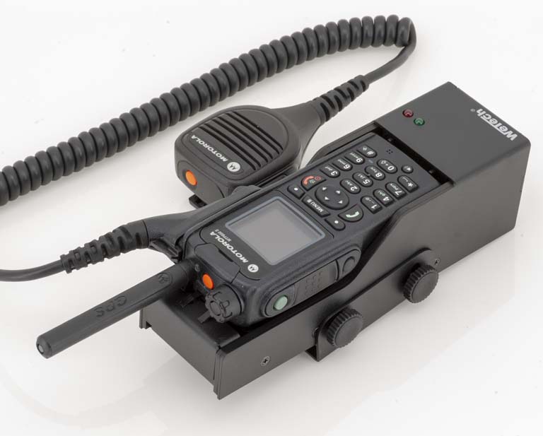 Radio device with detachable microphone and coiled cable