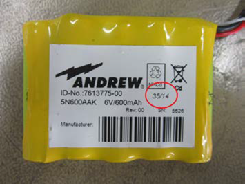 Gele batterij met label 6V, 600mAh, fabrikant Andrew, ID 7613775-00.