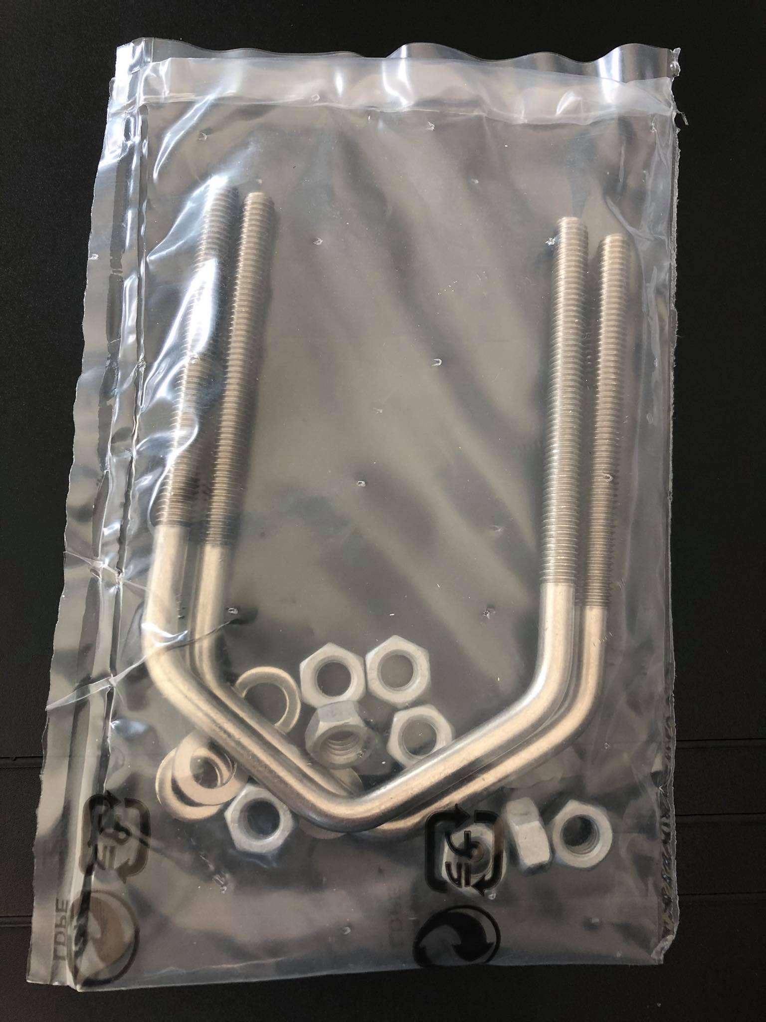 Metal U-bolts and nuts in plastic packaging.