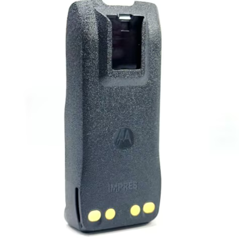 Rear view of a black radio battery with three yellow contacts.