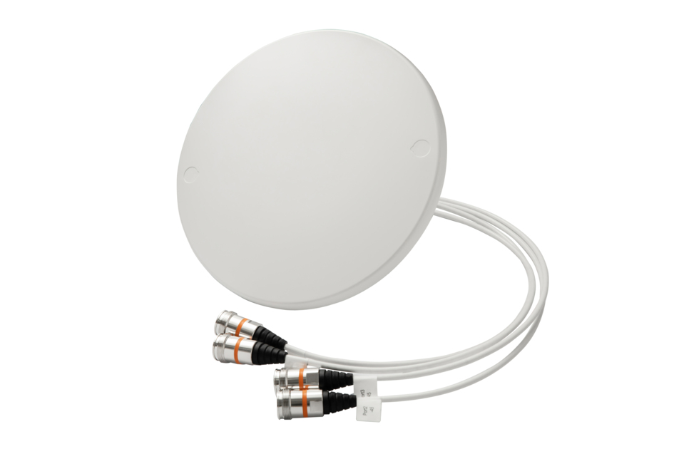 Ronde witte sensor met drie kabels en aansluitingen.