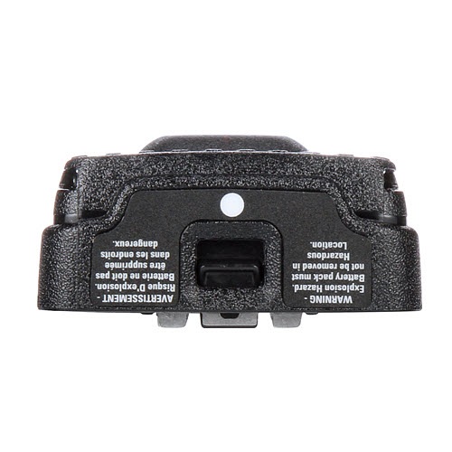 Bottom view of an unidentified electronic device with warning labels.