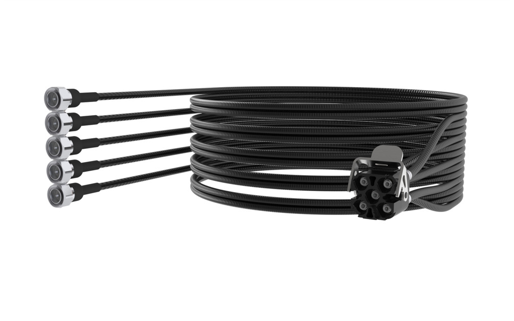 Coiled black industrial cable with five connectors at one end.