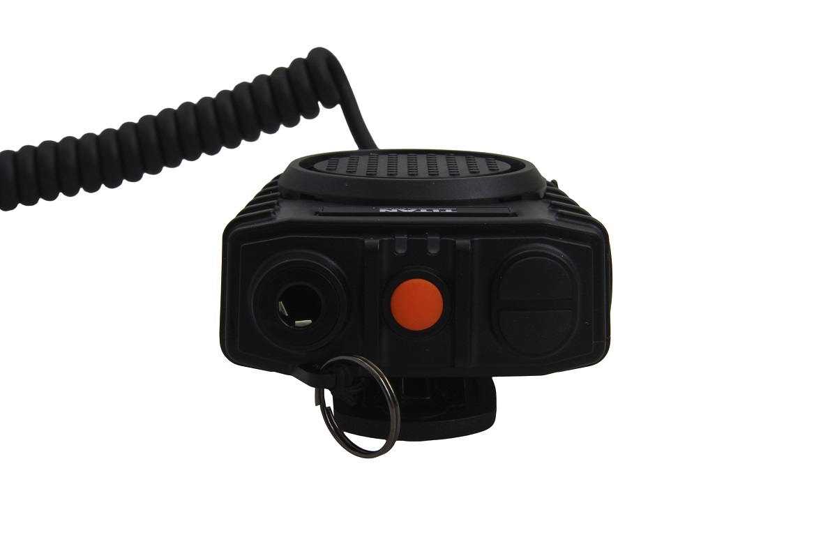 Radio with coiled cable and orange button.