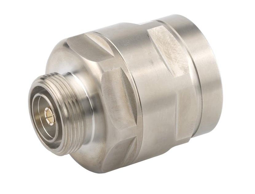 Metal coaxial connector with threading and hexagonal surfaces.