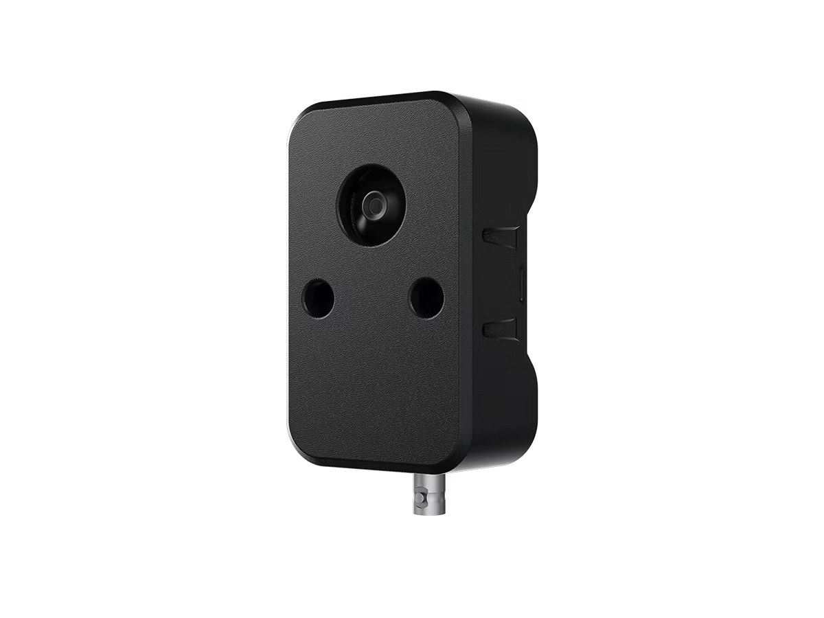Black rectangular motion sensor with camera opening.