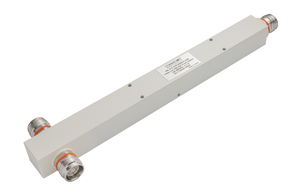 White electronic component block with two connectors at the ends.