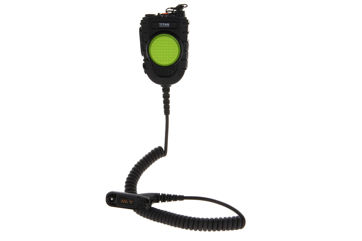 Haut-parleur radio noir avec bouton vert et câble spiralé.