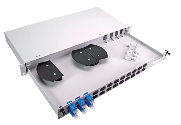 Distribution enclosure with front connection ports, two black spools, and cable management fixtures inside.