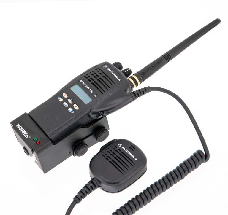 Handheld radio with antenna and detachable microphone.
