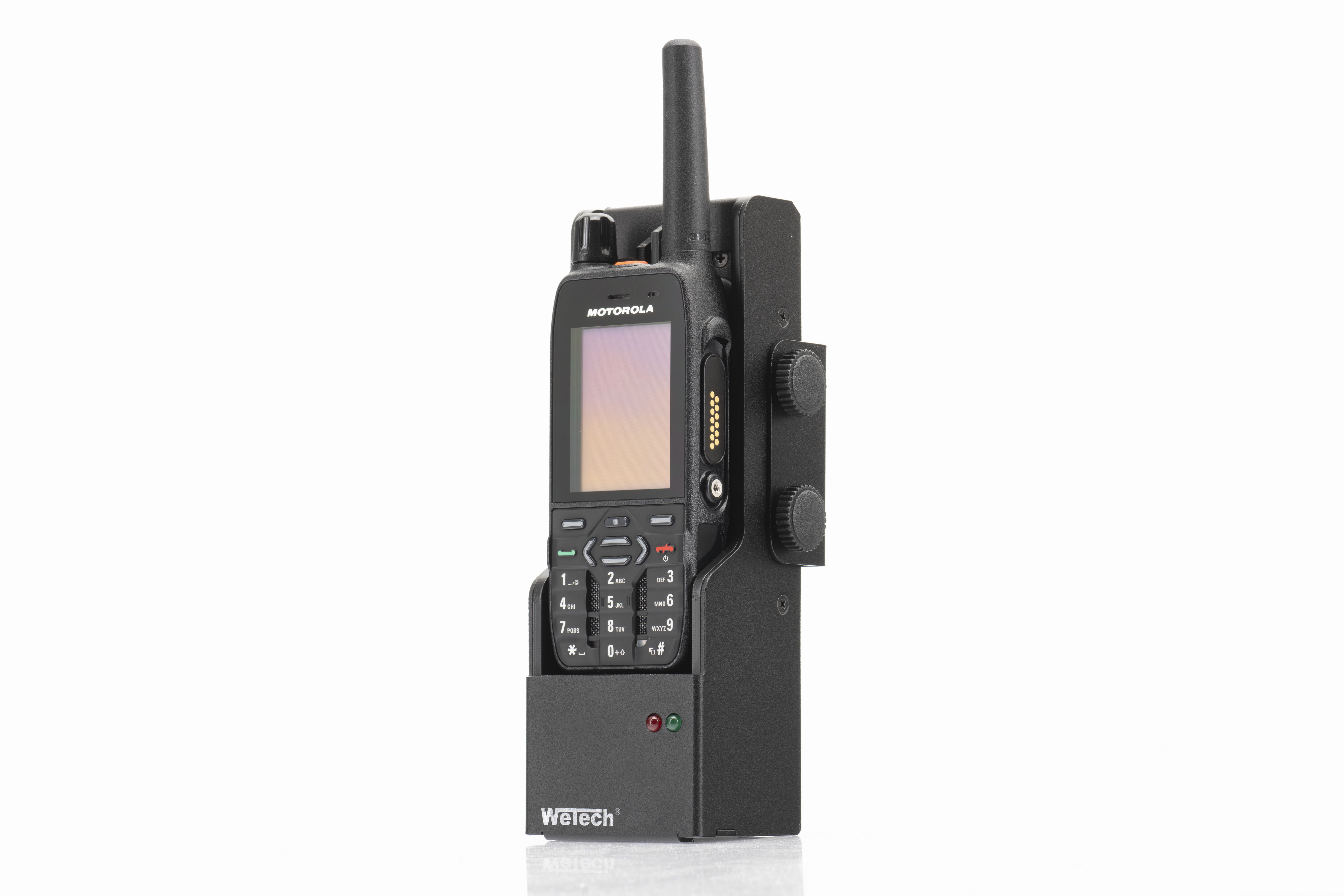 Black radio device with antenna in holder, front view.