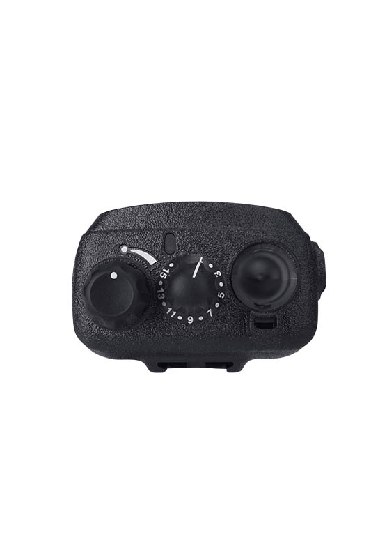 Black camera control panel with dials and button.