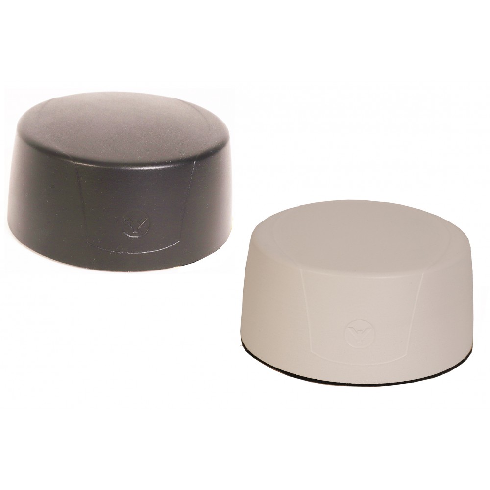 Two round plastic covers, one black, one beige.
