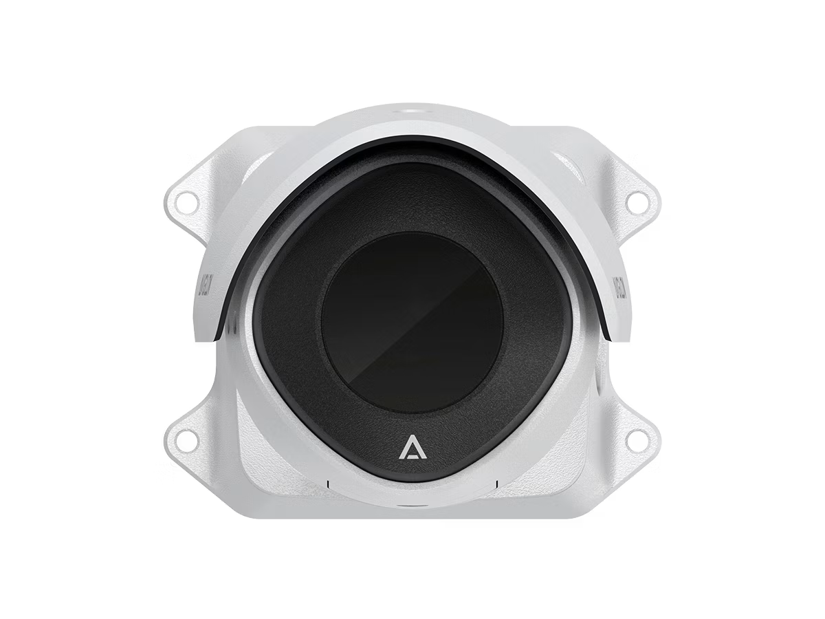 Round metal device with black center and four mounting holes.