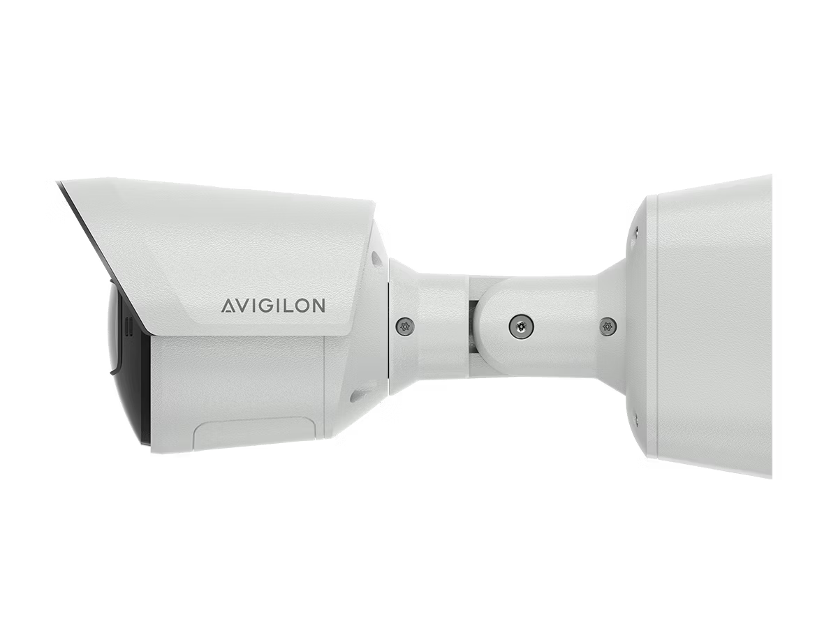 Beveiligingscamera zijaanzicht, witte behuizing.