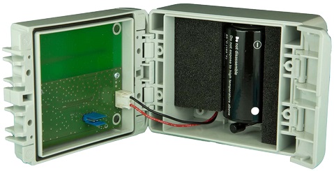 Open plastic case with circuit board and battery.