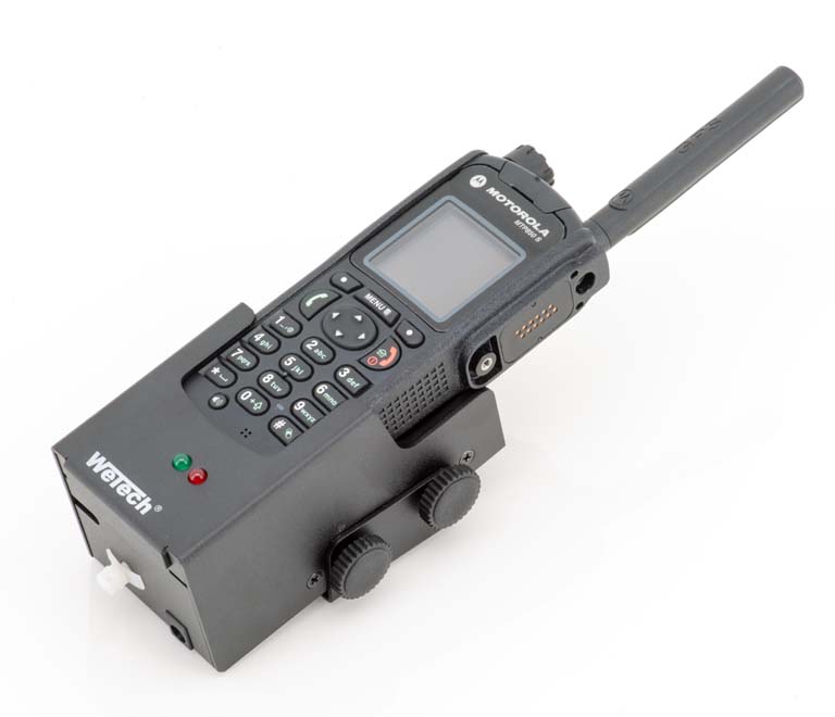 Radio device with antenna and keypad on a black mount.