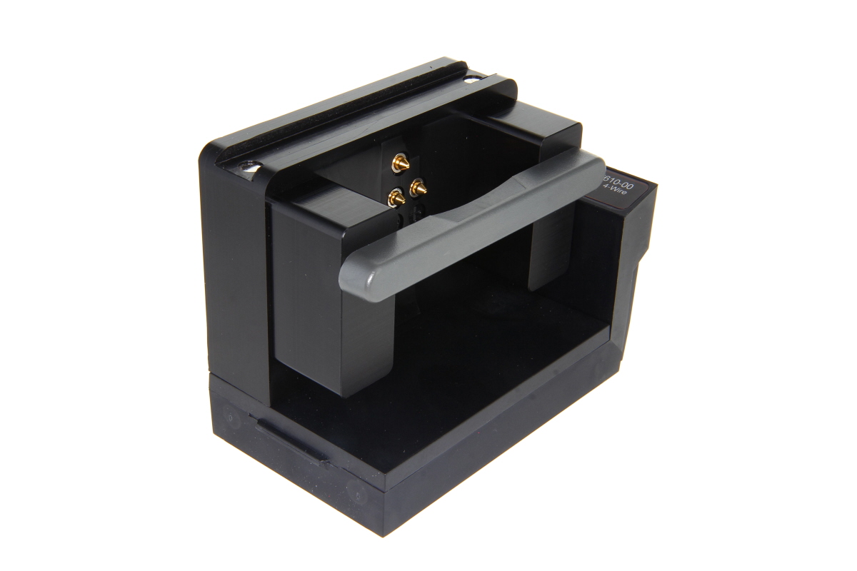Black mount with handle and metal contacts, side view.
