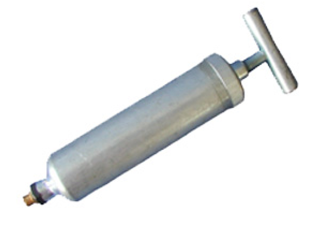 Silver grease gun with T-handle and nozzle fitting.