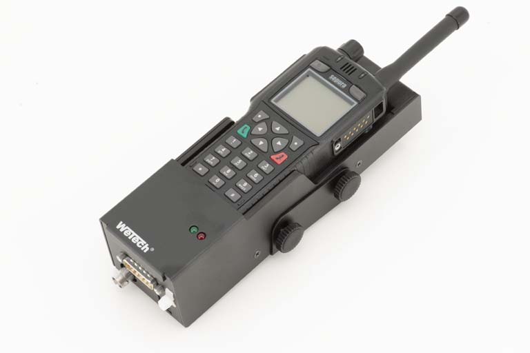 Radio with keypad and antenna, mounted on black bracket.