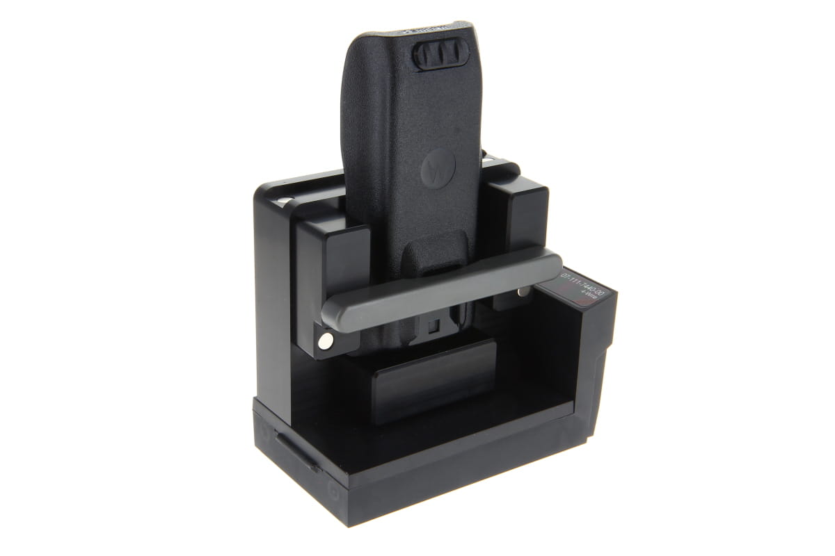 Black charger with radio device inserted.