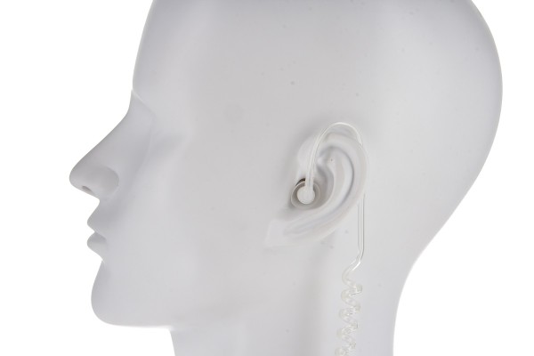 White mannequin with earpiece and coiled cable in left ear.