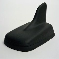 Black car roof antenna with shark fin design.