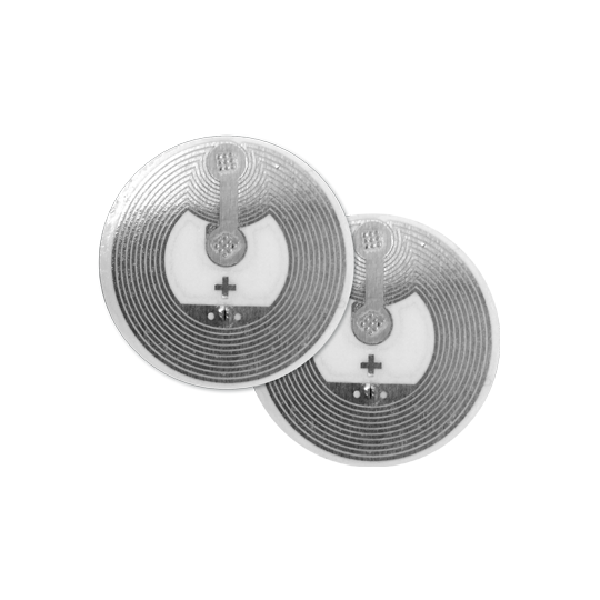 Twee ronde zilveren NFC-stickers met plus- en mintekens.