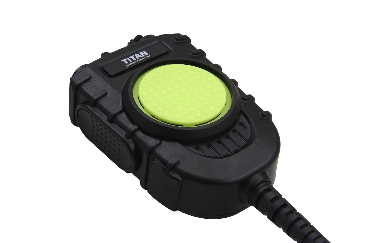 Zwart communicatieapparaat met grote groene knop in het midden.