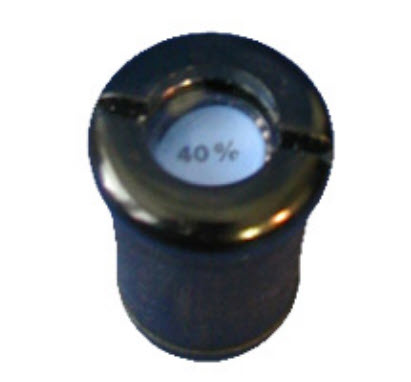 Close-up van een rond metalen object met 40% markering bovenop.