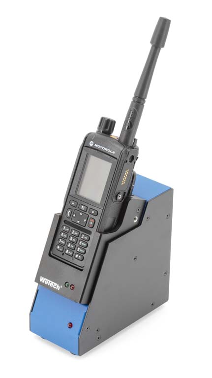 Radio in charging dock with buttons, display, and antenna.