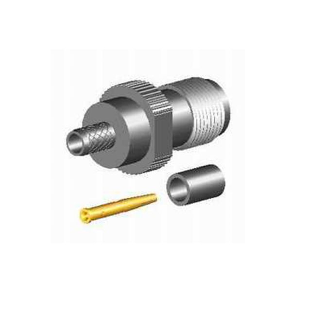 Connecteur coaxial avec boîtier en métal et broche de contact dorée séparée.