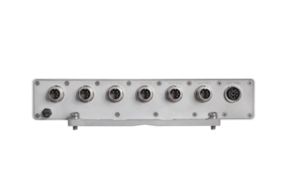 Back of a device with seven circular connector sockets.