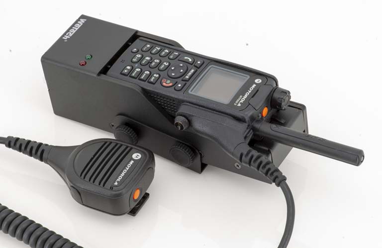 Radio with antenna, microphone connected via cable.