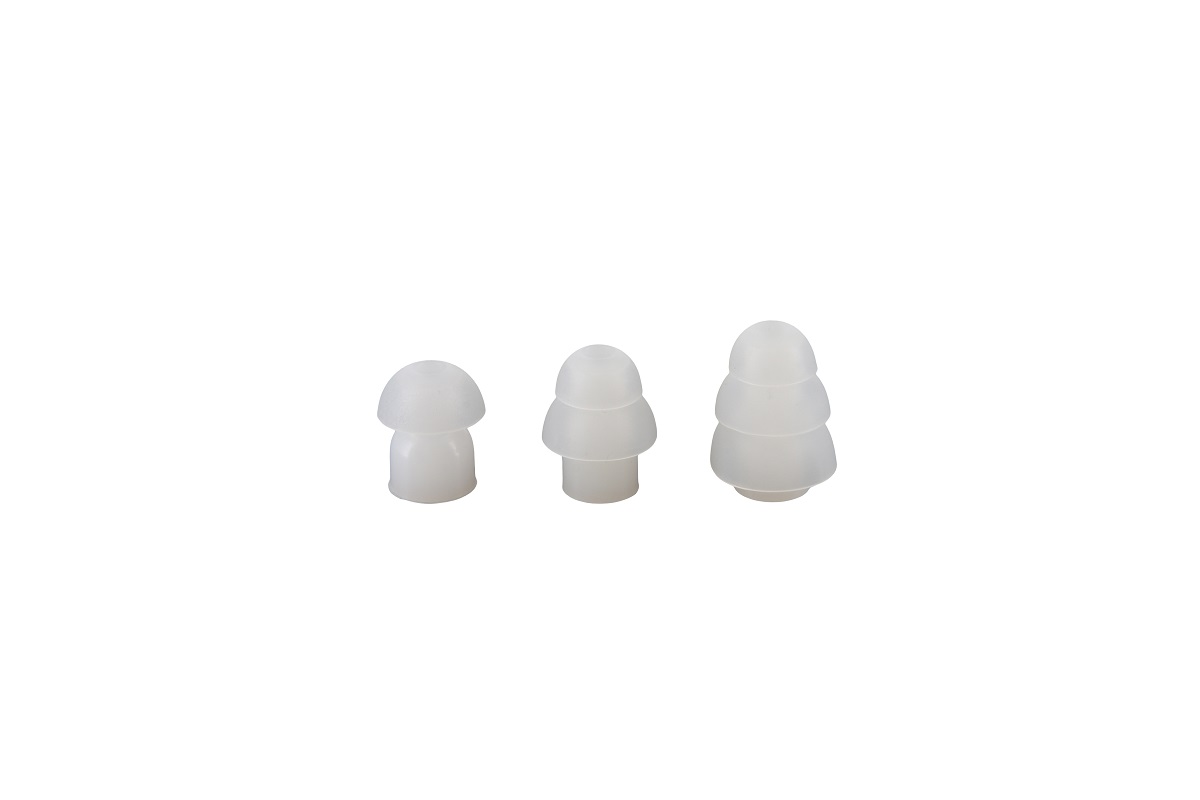 Three white, mushroom-shaped silicone forms, sorted from small to large.