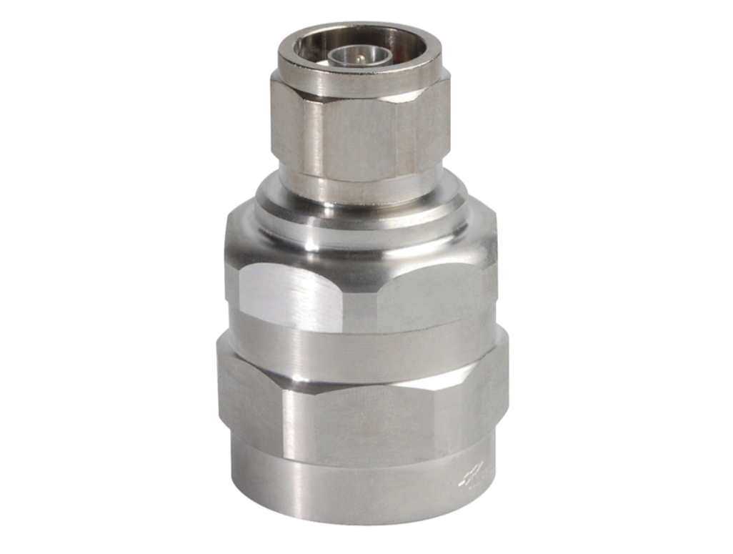 Adaptateur métallique avec écrou hexagonal et corps cylindrique en acier inoxydable.