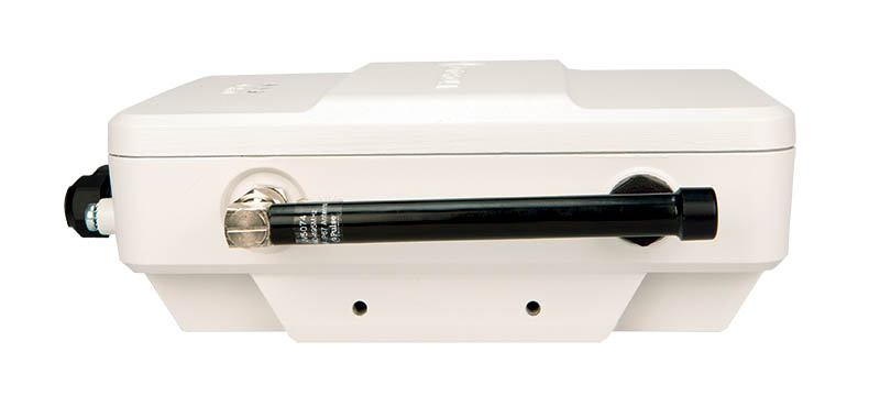 White rectangular device with black cylinder on the side.