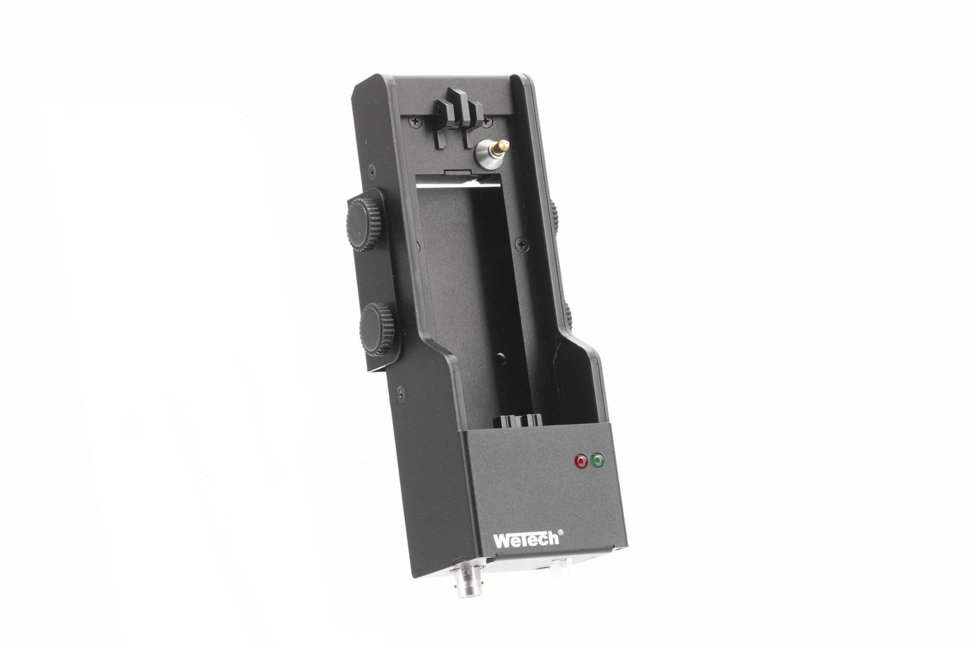 Black rectangular technical device with knobs and LEDs.