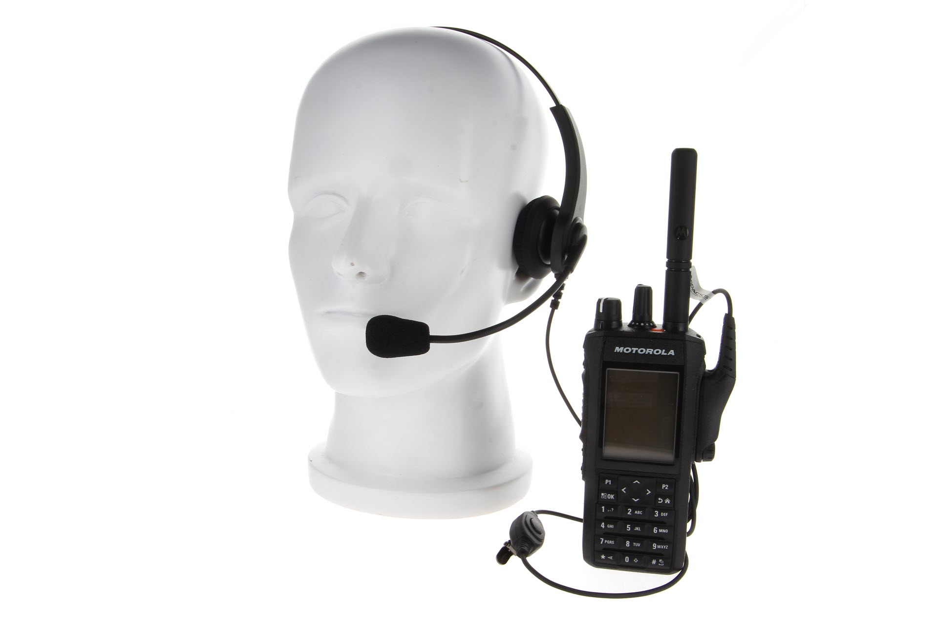 Hoofdtelefoon op mannequinhoofd met draagbare radio, Motorola-logo.
