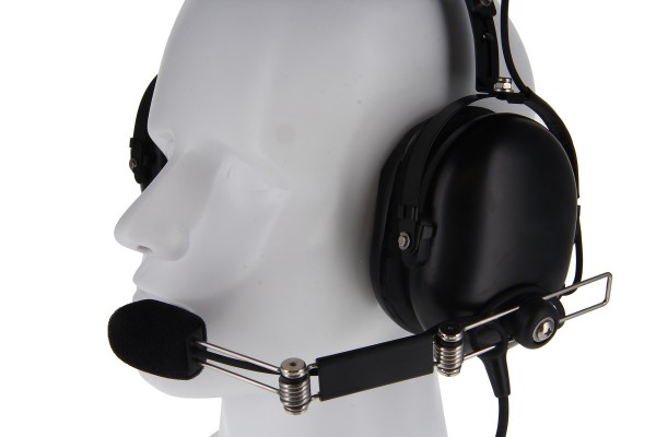 Head model with black headset and microphone, side view.