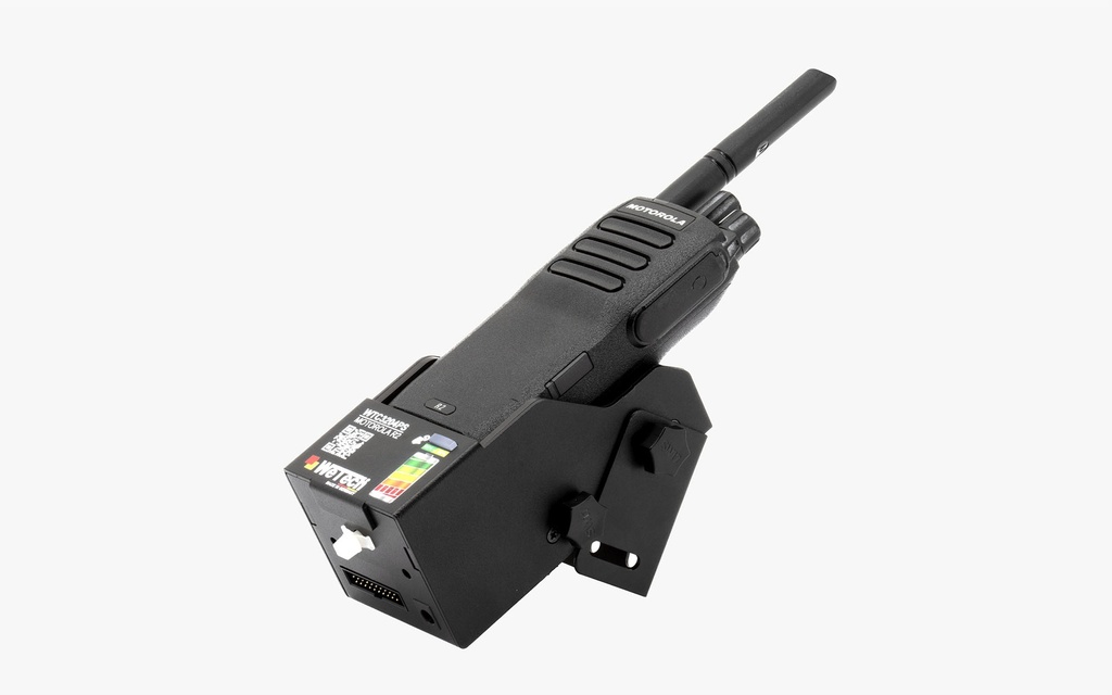 Black radio on charger with cable connector.