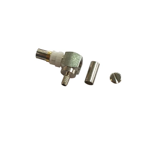 Coaxial plug and two metal parts, one cylindrical, one flat.