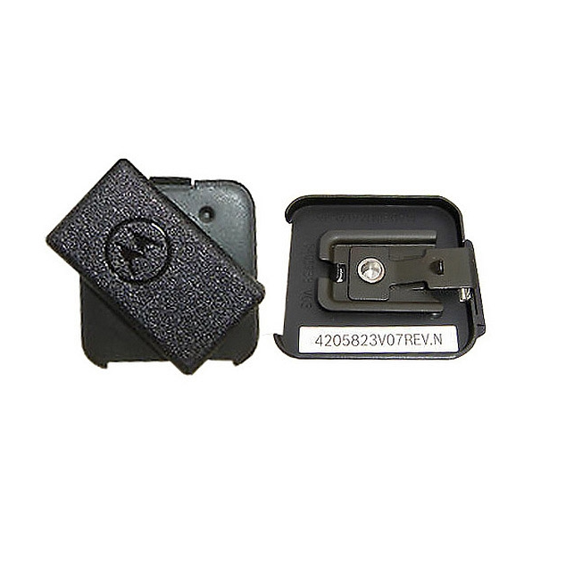 Two black plastic covers, one with screw, side by side comparison.