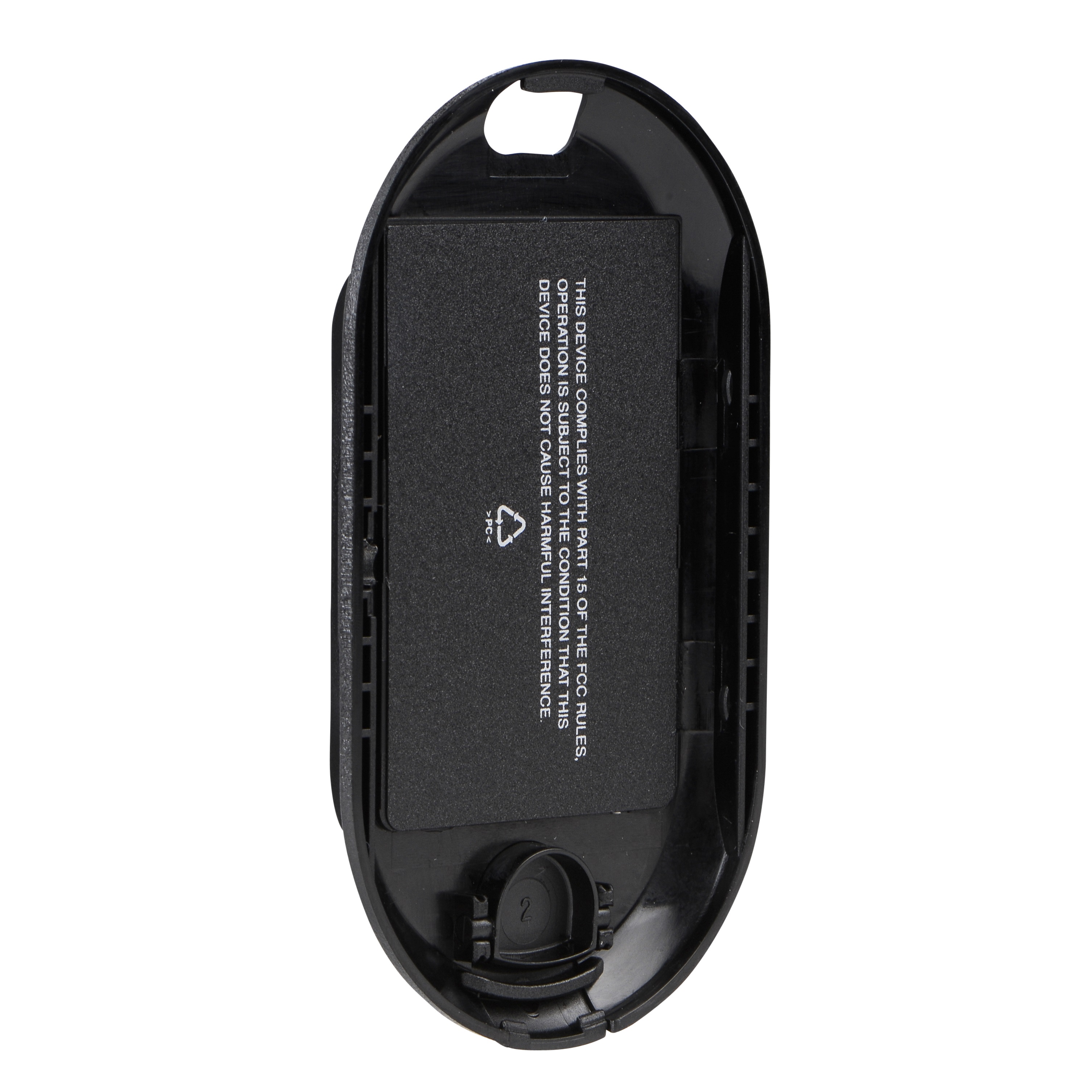 Open battery compartment with inserted battery and FCC text.