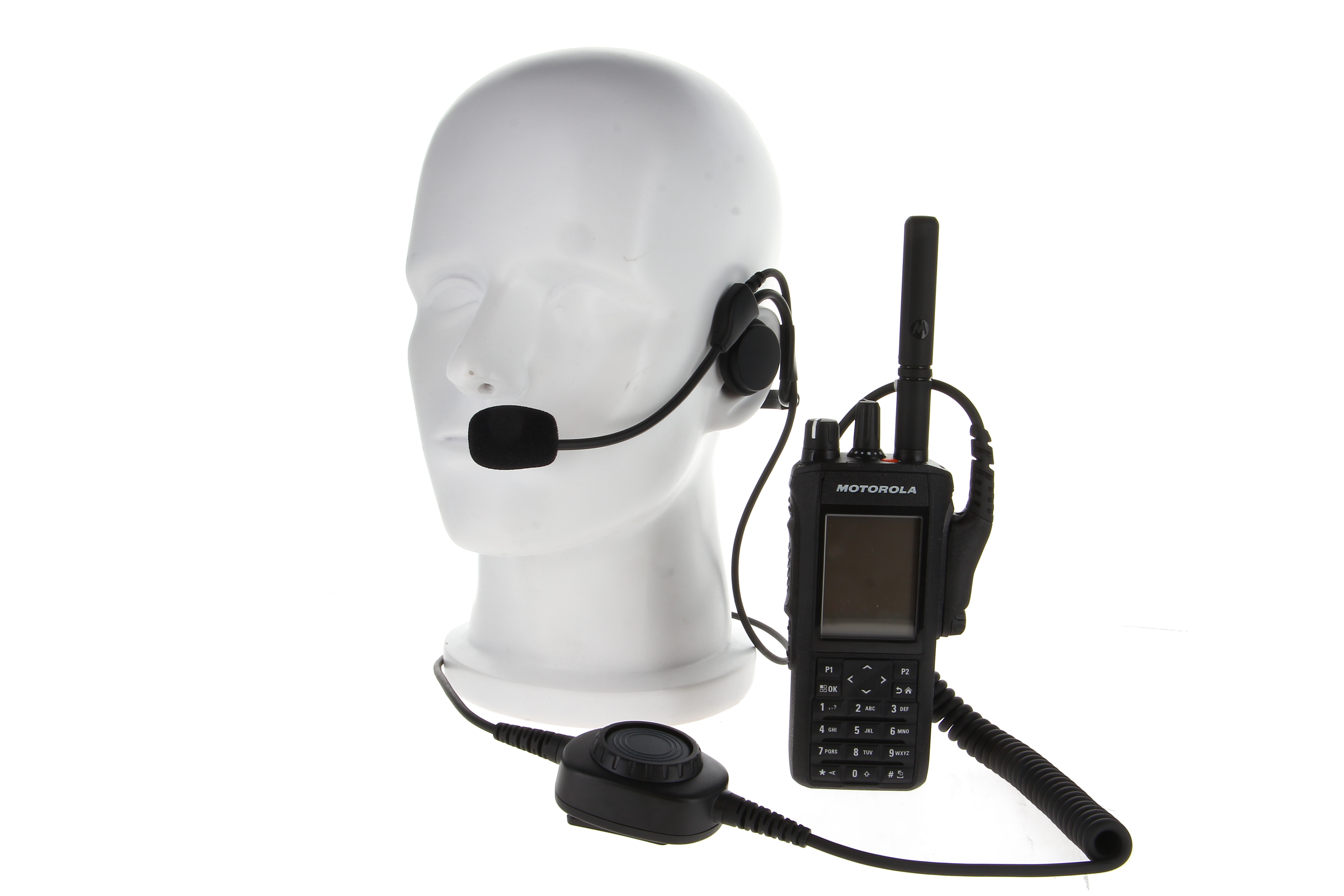 Headset en radio op een modellens hoofd.